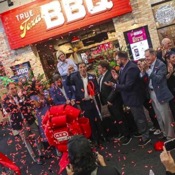 Confetti is launched into the air after Matt LoBello of H-E-B cuts the ribbon to celebrate the grand opening of the new H-E-B supermarket opening in McKinney, Texas on Tuesday, July 18, 2023. CHRIS TORRES ctorres@star-telegram.com
