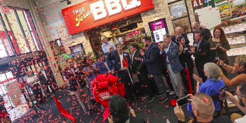 Confetti is launched into the air after Matt LoBello of H-E-B cuts the ribbon to celebrate the grand opening of the new H-E-B supermarket opening in McKinney, Texas on Tuesday, July 18, 2023. CHRIS TORRES ctorres@star-telegram.com